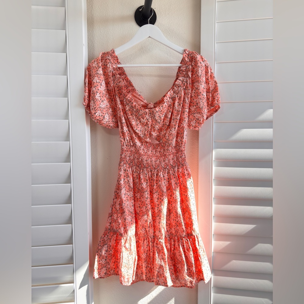 Gogo apparels.Size M. Open backFloral Orange Dress